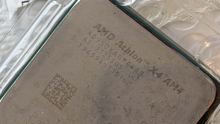 A close-up of an AMD Athlon X4 AM4 processor with model number A955XAGM44AB engraved on the surface.