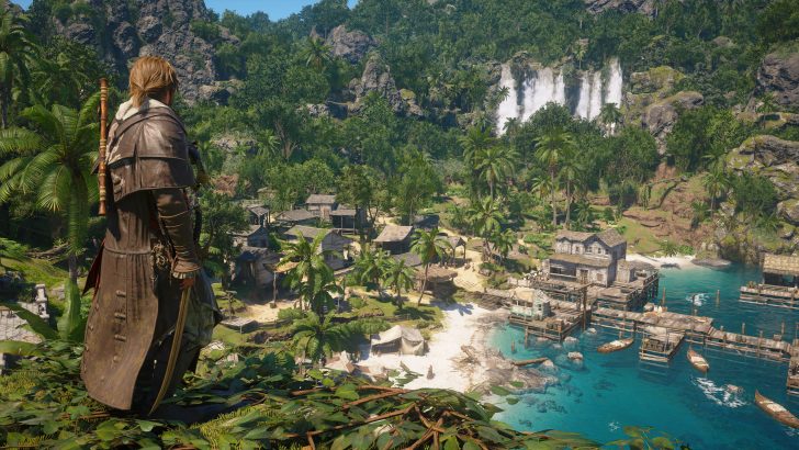 A character in 'Assassin's Creed IV: Black Flag' overlooks a lush tropical village with a waterfall and coastline in the background.