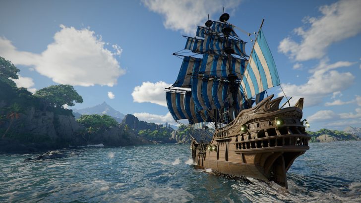 A large wooden sailing ship with blue and white striped sails navigates through the ocean near a lush, mountainous island under a partly cloudy sky.