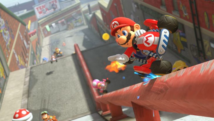 Mario is racing on a red rail in 'Mario Kart,' performing a trick while other characters follow behind in the background.