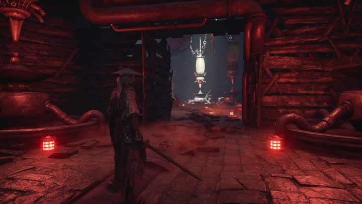 A character in Phantom Blade Zero stands in a dimly lit industrial area with pipes, holding a sword near a glowing red lantern.