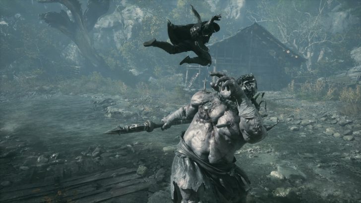 A character in the game Phantom Blade Zero leaps towards a large monster holding a spear, with a rustic house in the background.