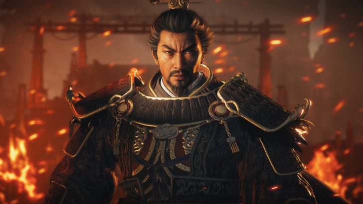A character in Wo Long 2: Wings of Ember wearing ornate samurai armor amidst a fiery background.